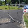 broken entrance gate with Notice - Restricted Access sign