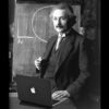 Albert Einstein using MacBook